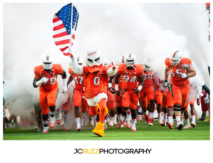 Sebastian the Ibis leads the Miami Hurricanes onto the field for the last time in the 2013 season