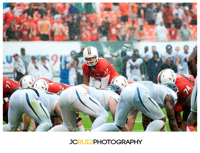 Miami QB, #17 Stephen Morris, yells out a play during a rain soaked game against Virginia