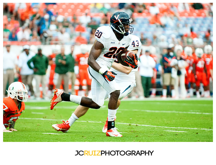 #20, Tim Smith, of the Virginia Cavaliers returns a punt against the Miami Hurricanes