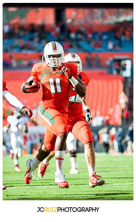 Hurricanes defensive player #11, David Gilbert, runs for a touchdown after a fumble recovery