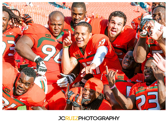Miami Hurricane seniors enjoy one last photo together after the victory against Virginia