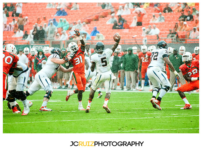Virginia QB, #5 David Watford, attempts a pass against Miami in a South Florida downpour
