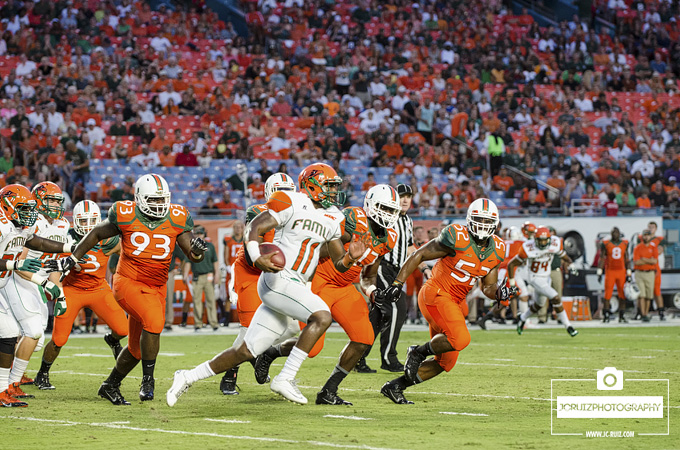 FAMU QB Damien Fleming runs away from Miami Hurricanes defense