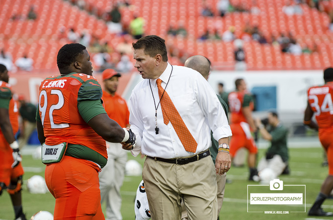 Al Golden greets players before the game