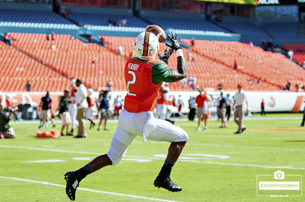 Running back Joe Yearby catching passes in warmups