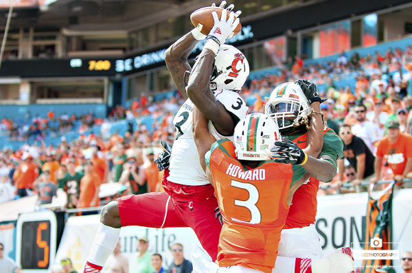 Cincinnati WR Johnny Holton battles for the pass