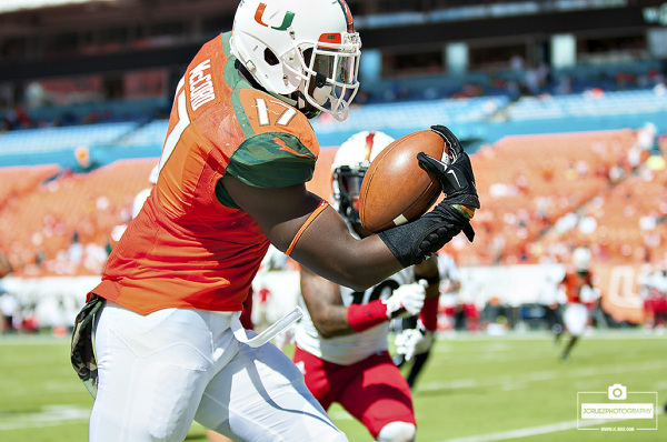 Tyriq McCord runs along the sideline after an interception