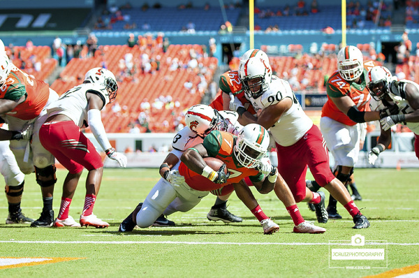 Gus Edwards gets tackled short of a touchdown