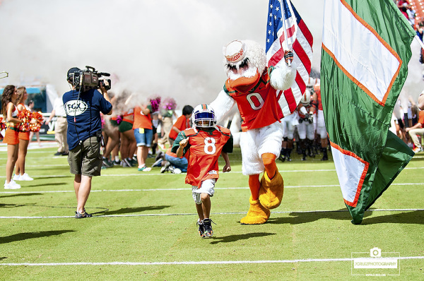 Carter Hucks leads the team onto the field