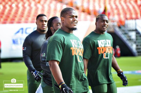 Denzel Perryman and Duke Johnson wear Kelly Tough shirts