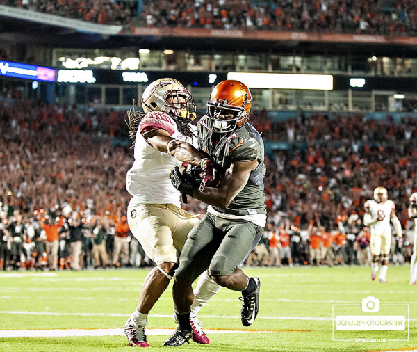 Miami WR #4 Phillip Dorsett scores a touchdown as Florida State DB #3, Ronald Darby, tries to take the ball away
