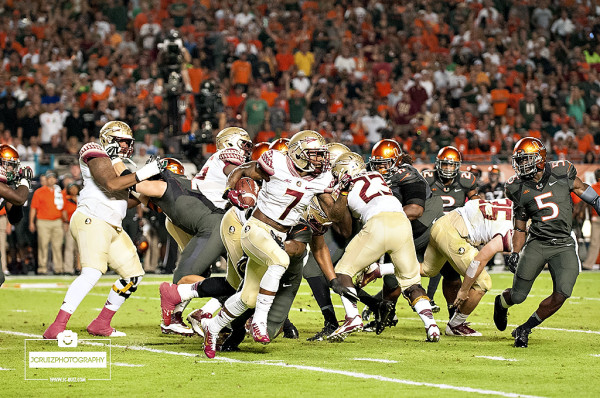 Florida State Seminoles RB #7, Mario Pender, rushes against the Miami Hurricanes