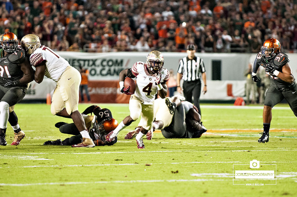 Florida State Seminoles RB #4, Dalvin Cook, finds a hole against the Miami Hurricanes defense
