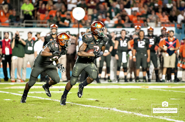 Miami Hurricanes WR #3, Stacy Coley, takes the handoff from Miami Hurricanes RB #8, Duke Johnson