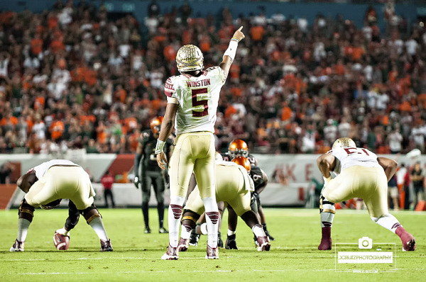 Florida State QB #5 Jameis Winston directs his WRs in a pre-snap audible