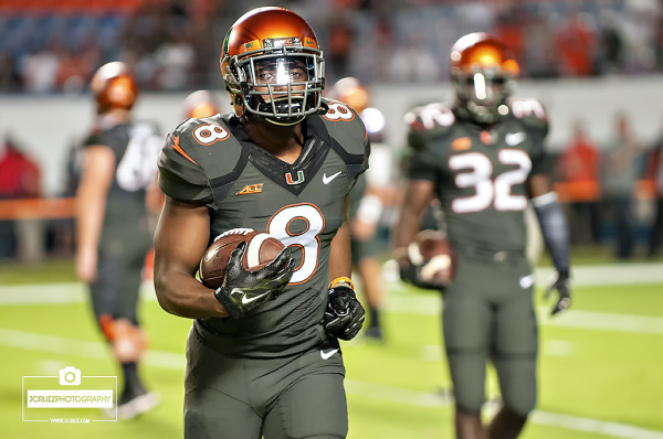 Miami RB #8 Duke Johnson runs through drills before the FSU game