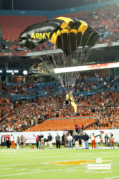 United States Army Golden Knights parachute team touchdown in Sun Life Stadium prior to kick off