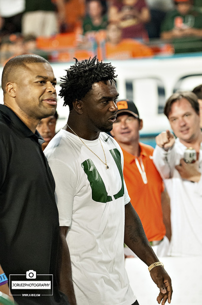 Former Miami Hurricanes RB Edgerrin James walks the sidelines prior to kickoff