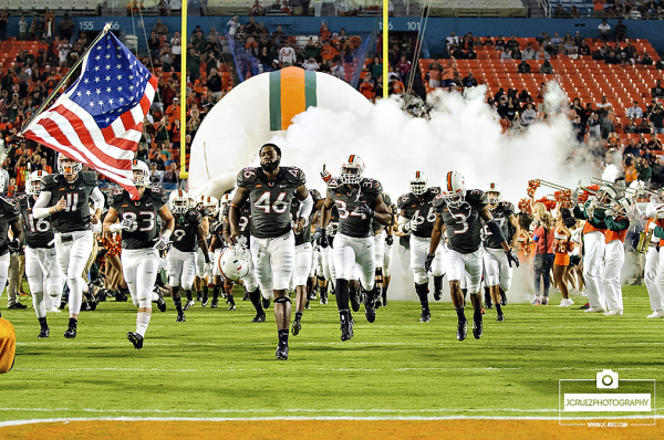 The Miami Hurricanes run out of the tunnel on Senior Day