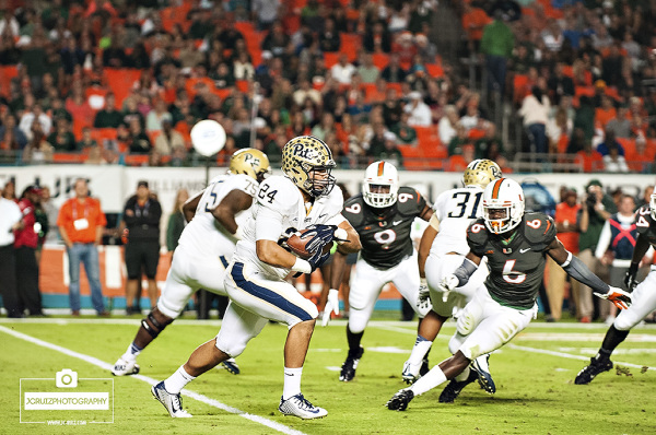 James Conner rushes past the Miami defense