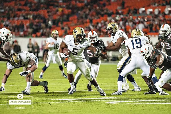 Chris James runs past the Hurricanes Defense
