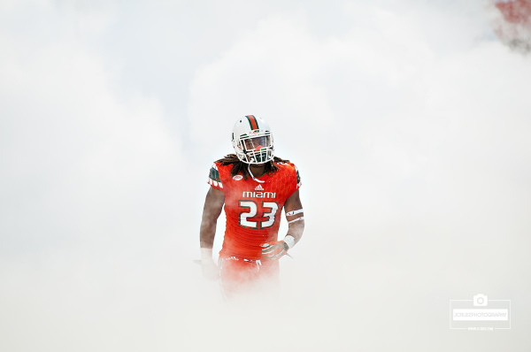 Terry McCray runs through the smoke