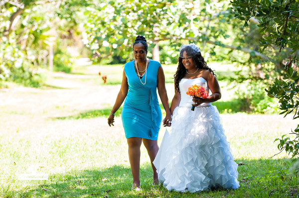 the brides mother walking her down the aisle