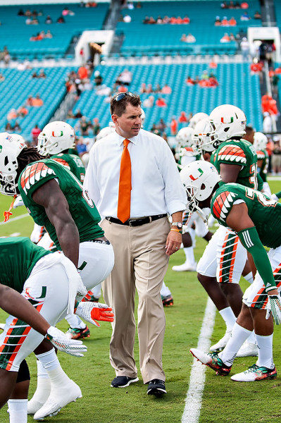 Miami Hurricanes Headcoach, Al Golden, watches his team warm up