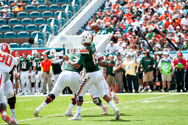 Hurricanes QB #15, Brad Kaaya, attempts a pass against Clemson