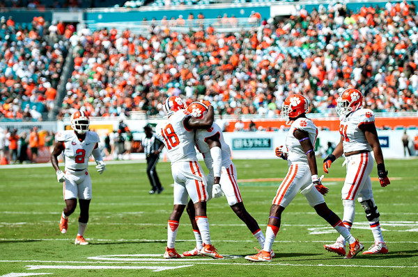 Clemson safety #18, Jadar Johnson, celebrates his interception with teammates