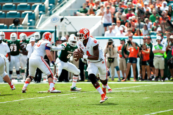 Clemson QB #4, Deshaun Watson, scrambles outside of the pocket against the Miami Hurricanes