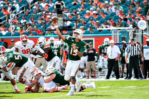 Miami Hurricanes QB #15, Brad Kaaya, attempts a pass against the Clemson Tigers