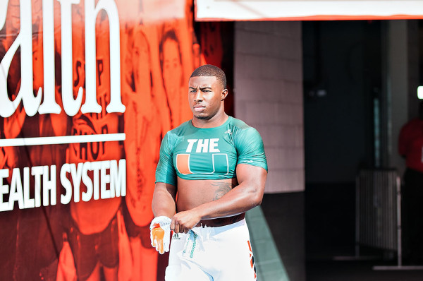 Miami Hurricanes linebacker #51, Juwon Young, puts on his gloves prior to warmups