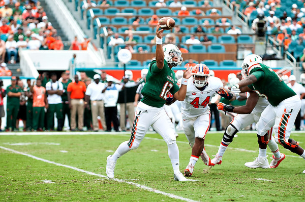 Hurricanes QB #12, Malik Rosier, attempts a pass against Clemson