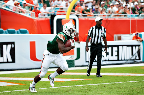 Hurricanes RB #1, Mark Walton, returns a kickoff