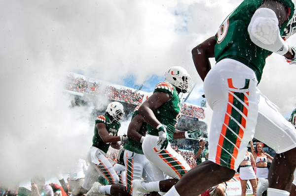 Hurricane players emerge from the smoke