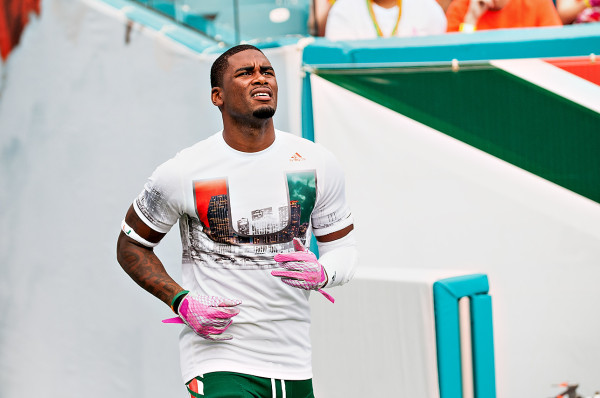 Miami Hurricanes wide receiver #3, Stacy Coley, comes out to warm ups looking at the planes flying the banners