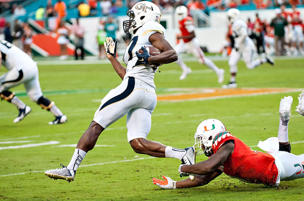 Lynn Griffin tries to evade the tackle of Jaquan Johnson