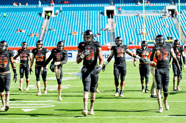 The Miami Hurricanes stretch before the game