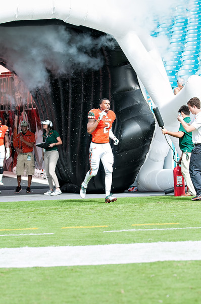 Deon Bush runs out the tunnel for Senior Day
