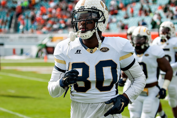 Georgia Tech players run onto the field