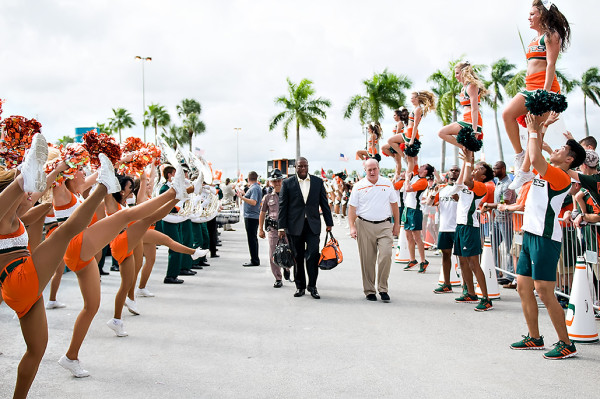 Miami head coach, Larry Scott, walks to the stadium
