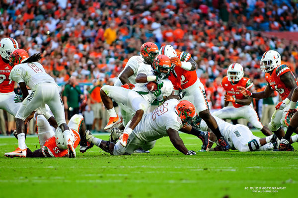 FAMU QB, Kenneth Coleman, gets tackled by Courtel Jenkins