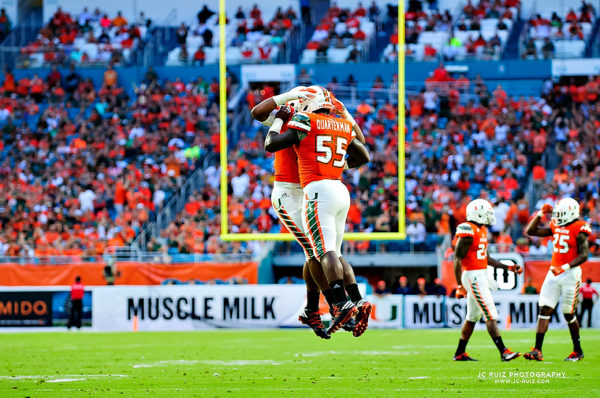 Hurricanes defenders Shaq Quarterman and Demetrius Jackson celebrate a sack by Jackson