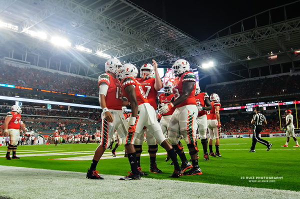 Miami offense celebrates a touchdown