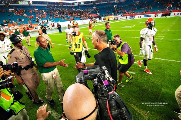 The coaches meet at the conclusion of the game