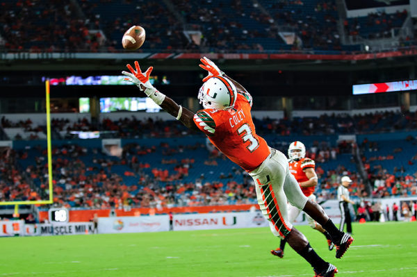 Hurricanes WR, Stacy Coley, leaps to try to catch the pass