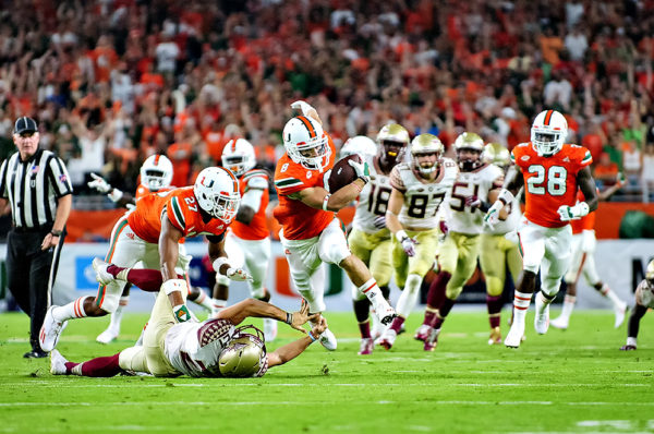 Hurricanes punt returner, Braxton Berrios, returns a punt