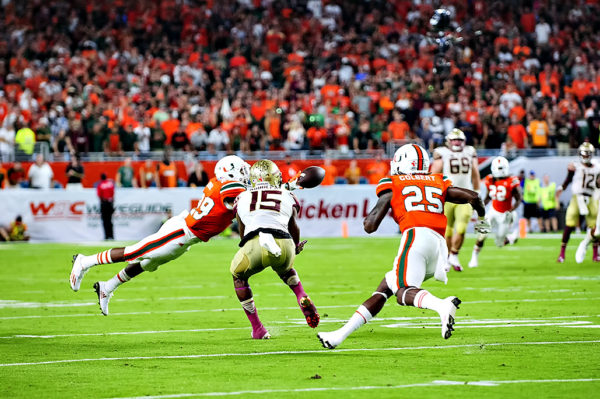 Hurricanes DB, Corn Elder, breaks up a pass