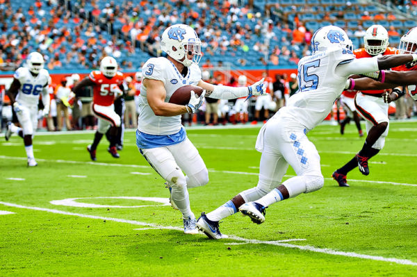 Tar Heels WR, Ryan Switzer, follows his blocker after a catch